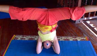 Kali doing headstand splits
